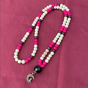 Hand assembled beaded necklace brass cat sitting on half moon